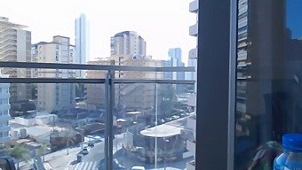 Attractive Gamer Girl Shows Off Her Assets While Dressed On An Outdoor Balcony