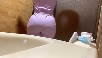 Amateur Recording Captures Naughty Nurse With Voluptuous Curves